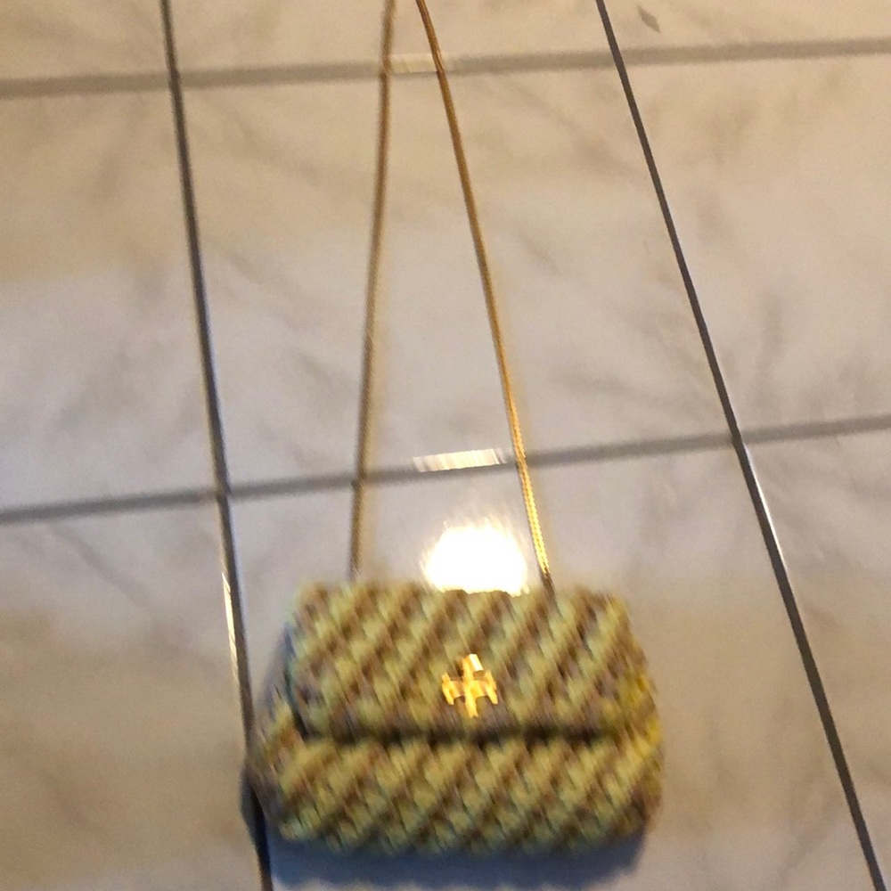 Tory Burch purse long gold color chain.